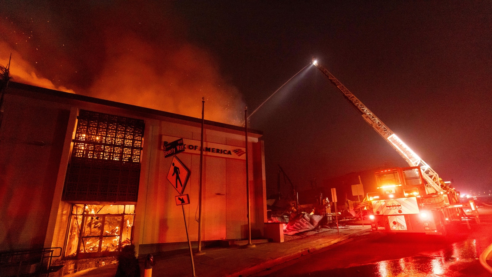 Wildfires latest: Winds subside as firefighters battle devastating blazes in Los Angeles area